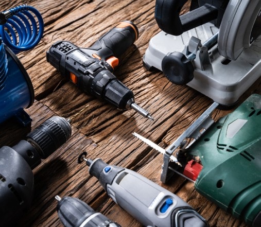 Collection of industrial power tools on a workbench