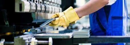 A worker handling aluminum